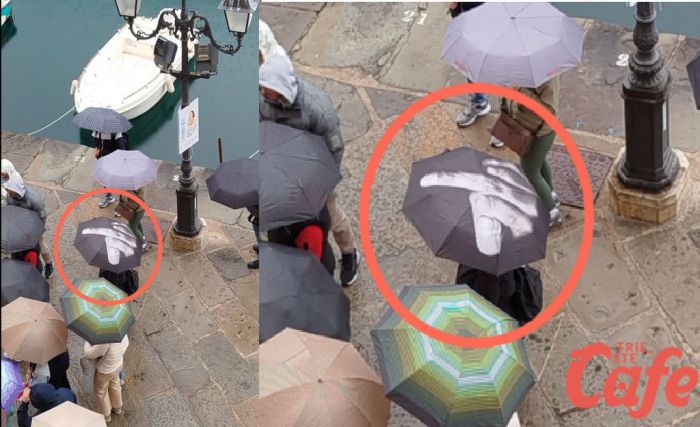 Spunta un ombrello “scorretto” tra i turisti: la foto virale sul Canal Grande a Trieste